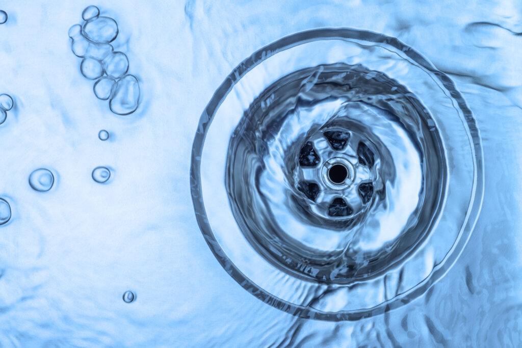 Water running down a kitchen sink.