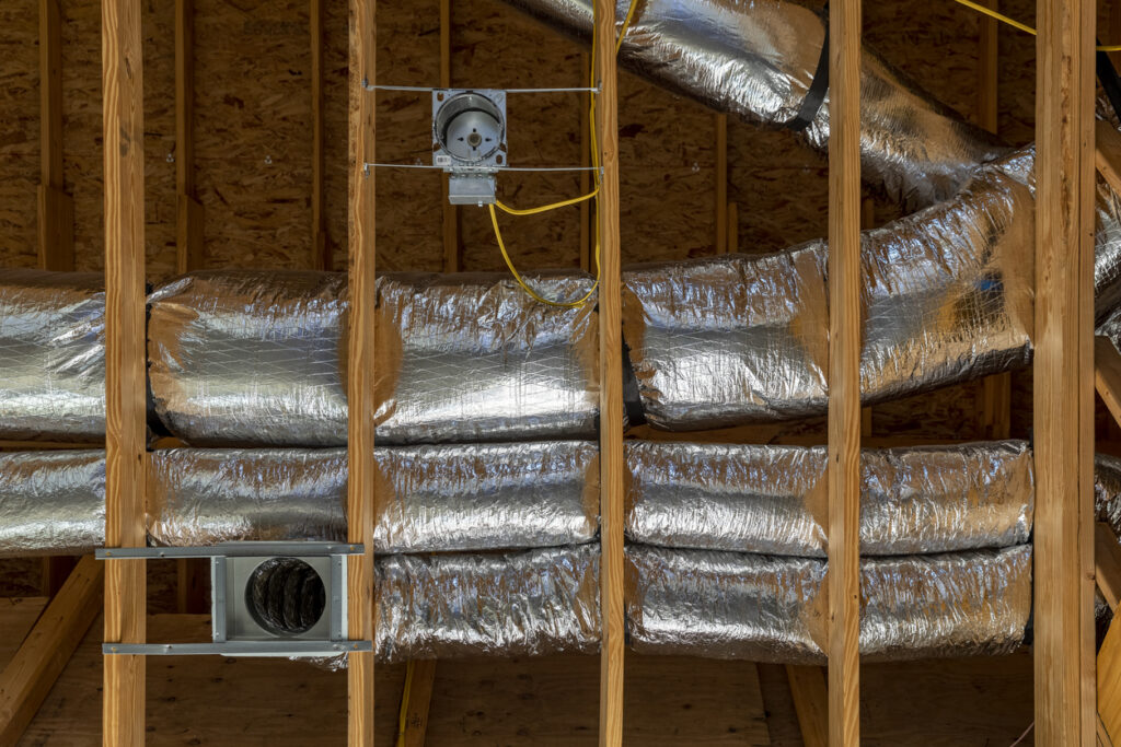 Installed of HVAC vent in roofing, silver.